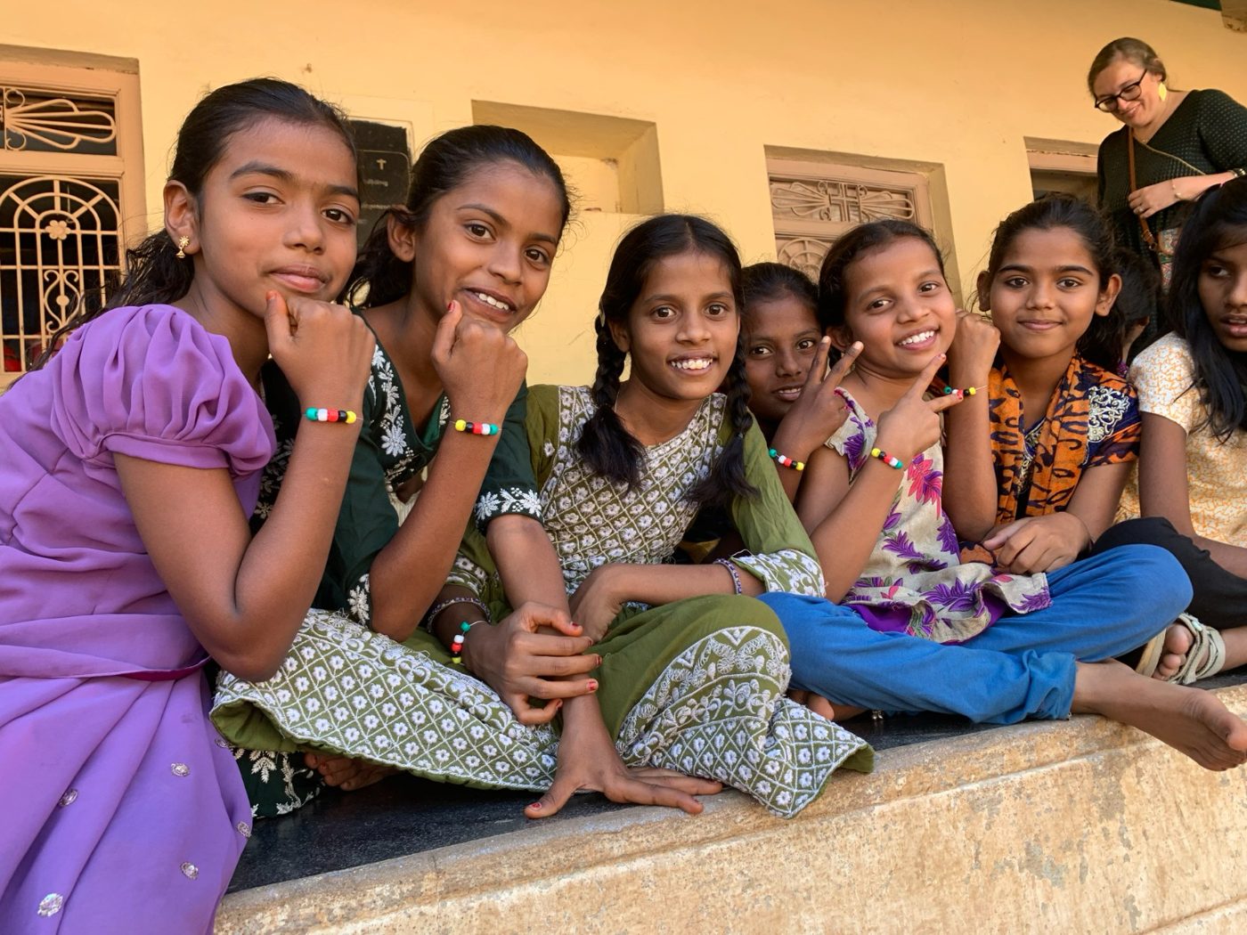 Girls at one of our children's homes in South Asia showing their bracelets