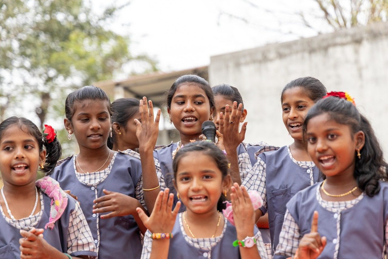 Girls singing together at school in South Asia