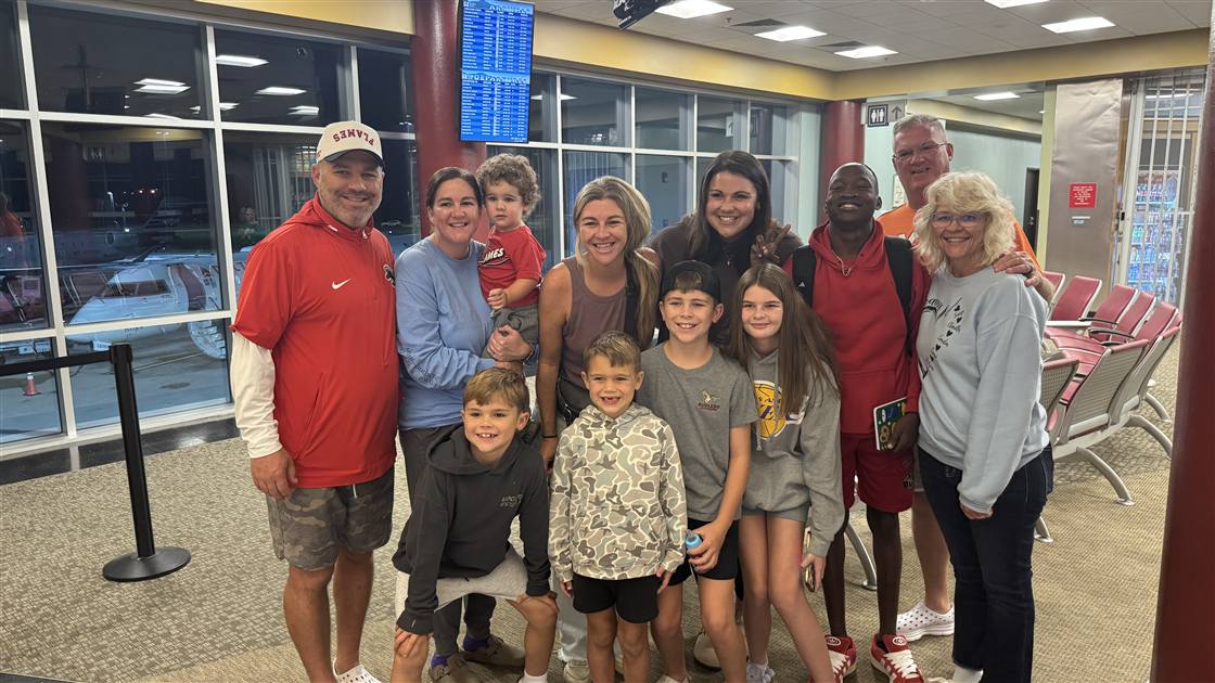 Family and friends welcoming Kervenson and Amber at the Roanoke airport